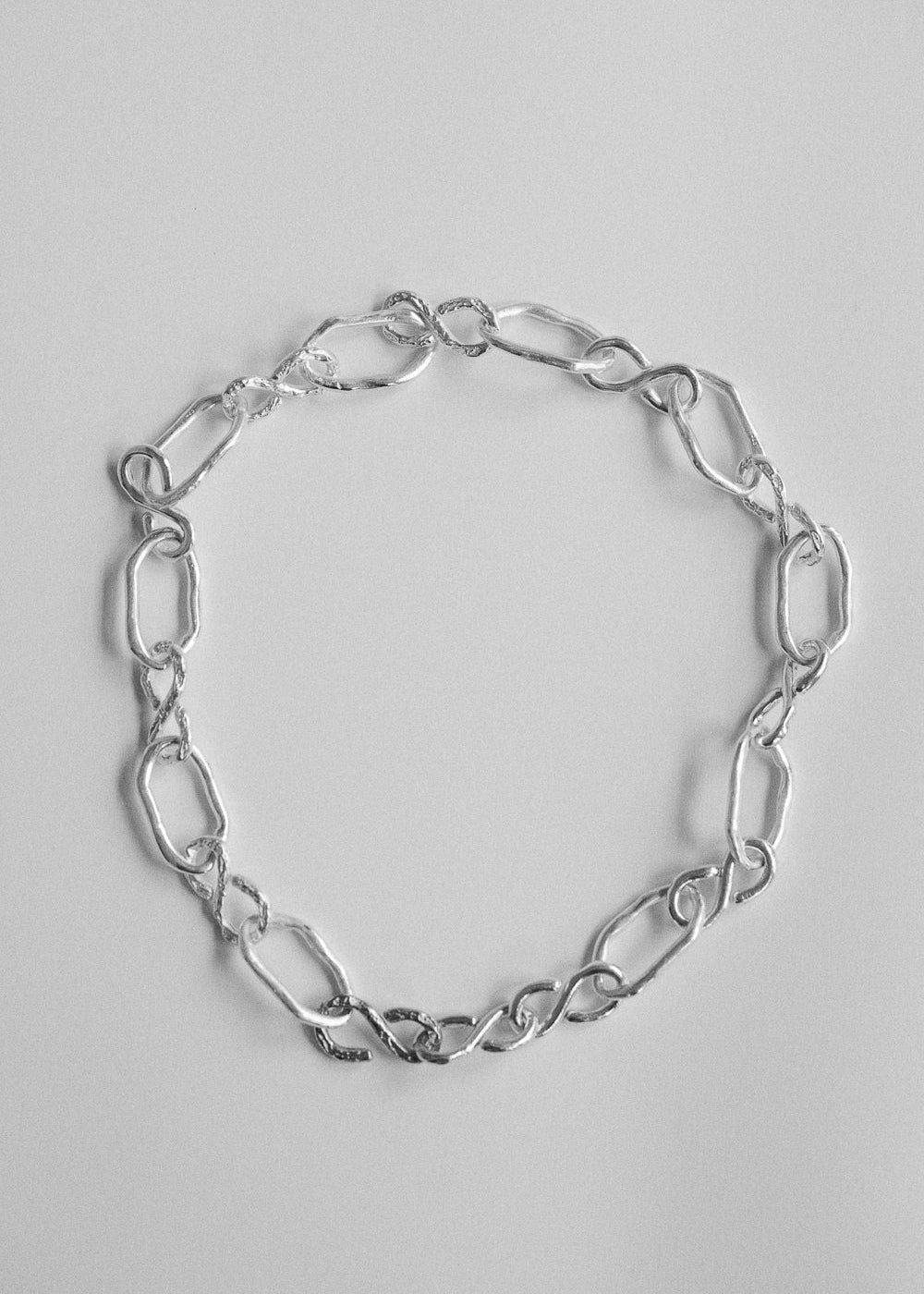 Sterling silver dog collar laid flat on a light background, handcrafted by RFL.